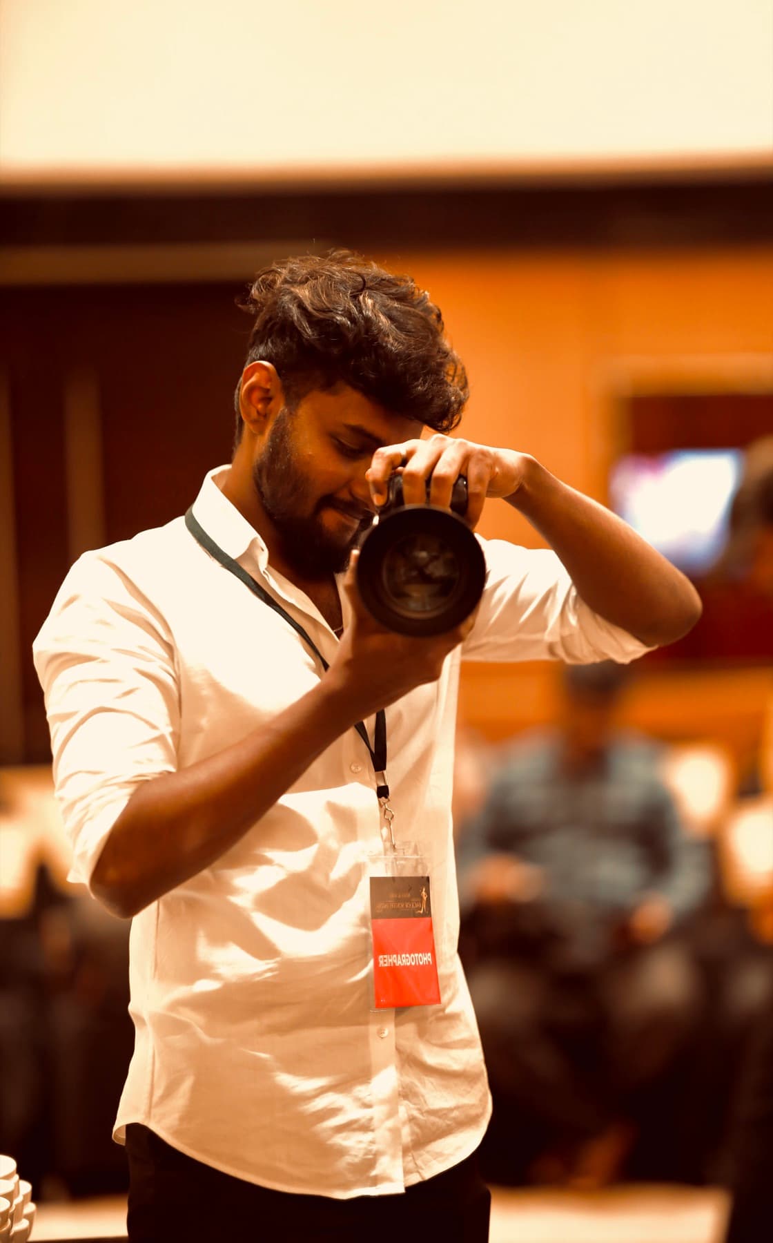 Aravinthan directing with a camera